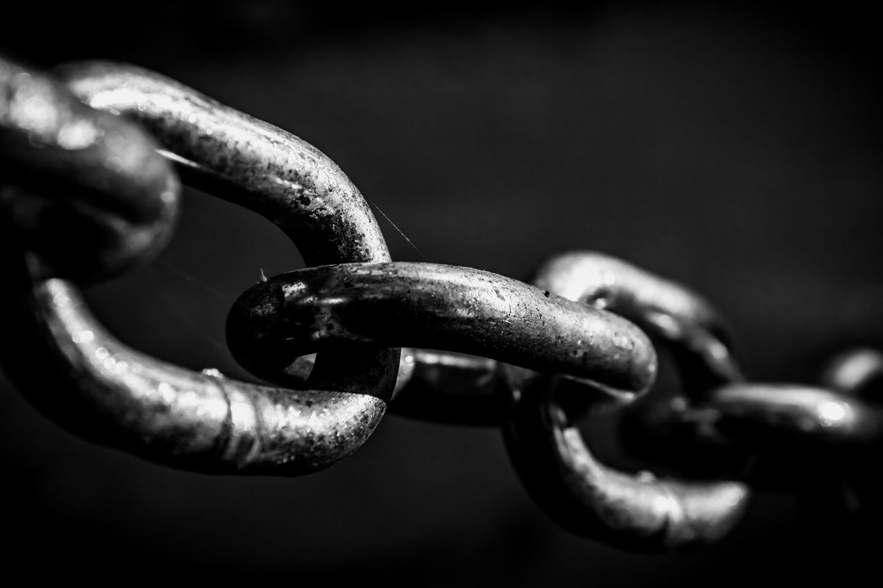 Shiney black and white chain Black and white close up shot to a stretched chain.