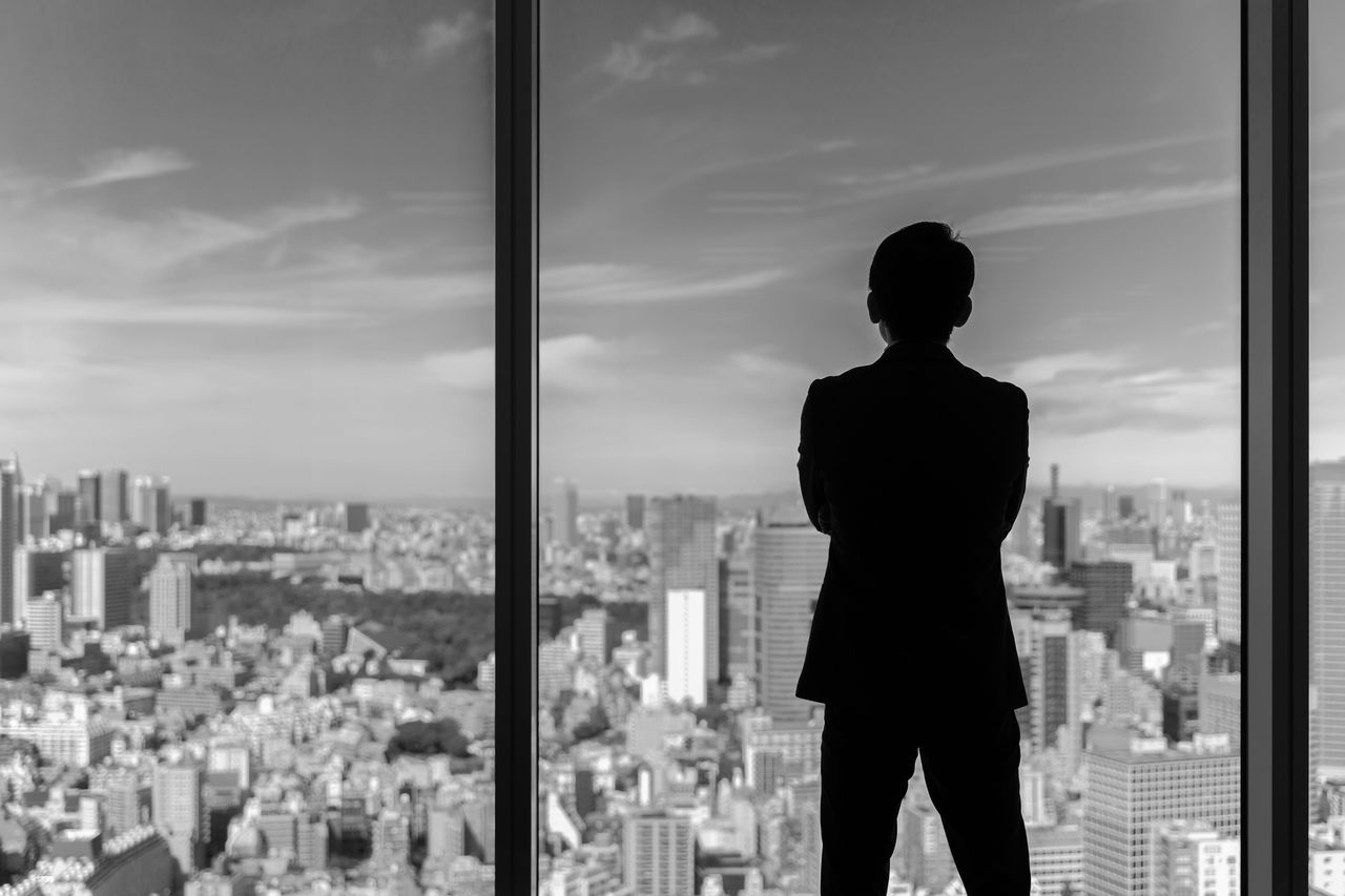 businessman wearing suit looking cityscape of tokyo businessman wearing suit looking cityscape of tokyo